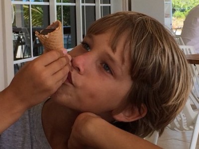 Joshua enjoys an ice cream